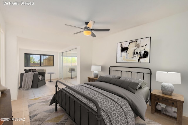 bedroom featuring ceiling fan and light tile patterned flooring