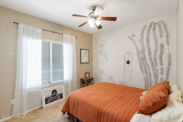 tiled bedroom featuring ceiling fan