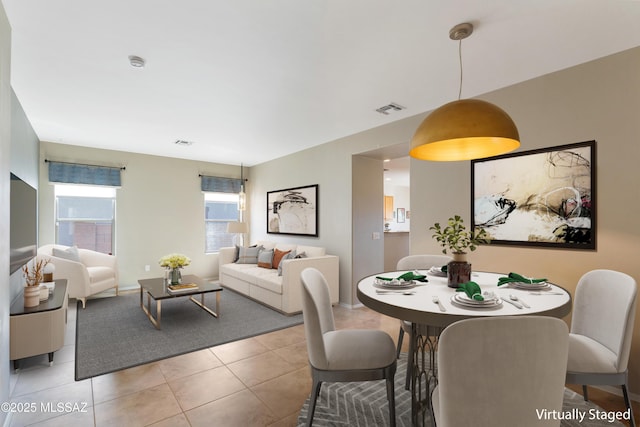 dining area featuring light tile patterned floors