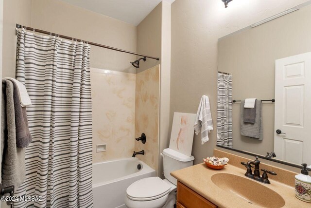 full bathroom featuring vanity, toilet, and shower / bath combo with shower curtain