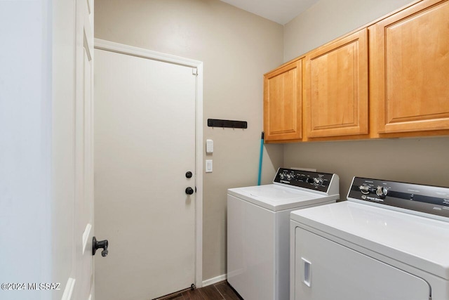 laundry area with cabinets and washing machine and dryer