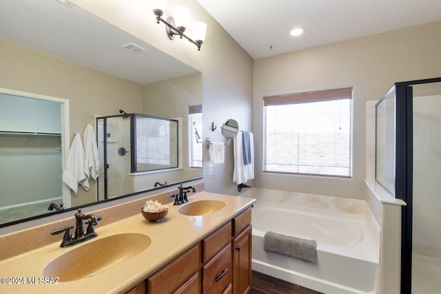 bathroom with vanity and plus walk in shower