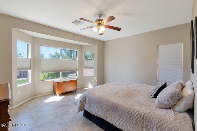 tiled bedroom with ceiling fan