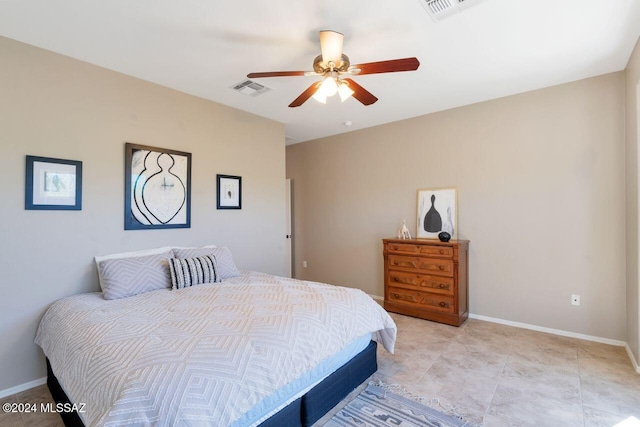 tiled bedroom with ceiling fan