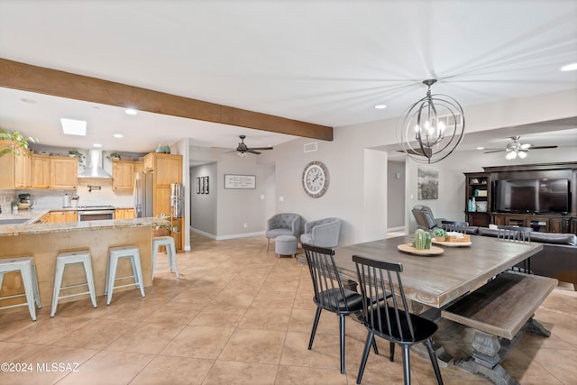 dining area featuring ceiling fan with notable chandelier, beam ceiling, and light tile patterned floors