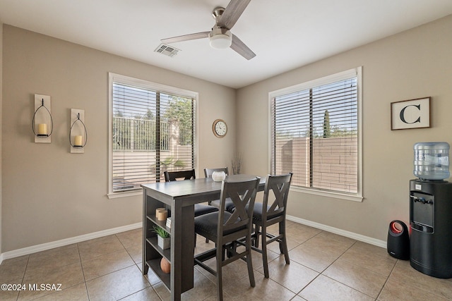 dining area featuring light tile patterned floors and ceiling fan