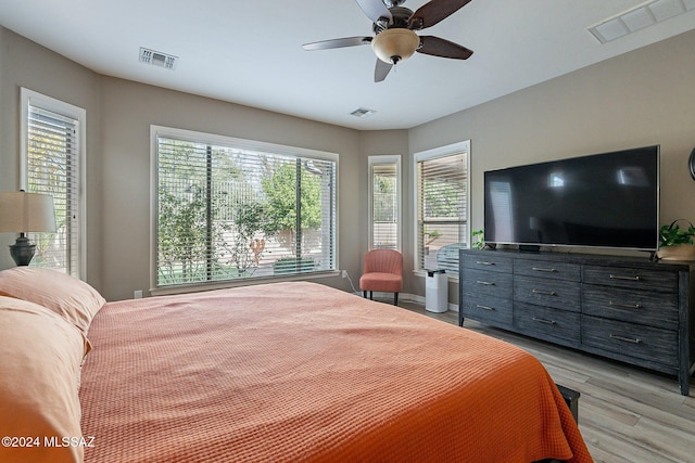 bedroom with light wood-type flooring and ceiling fan