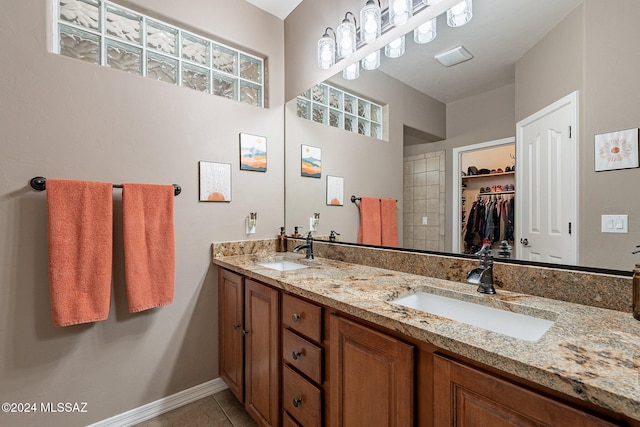 bathroom featuring tile patterned flooring and vanity