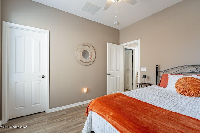 bedroom with ceiling fan and light hardwood / wood-style floors