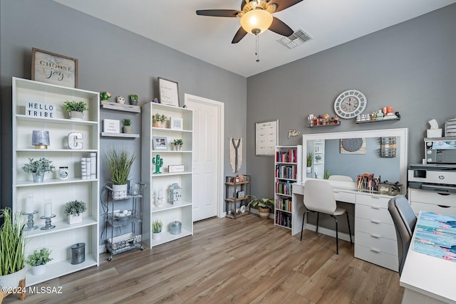 office space with ceiling fan and light wood-type flooring