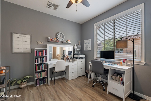 home office with ceiling fan and light hardwood / wood-style flooring