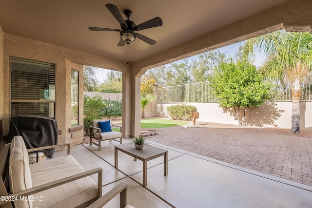 view of patio / terrace with area for grilling and ceiling fan