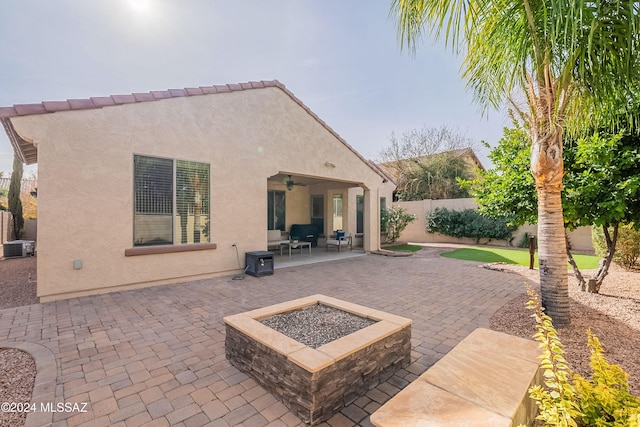 view of patio featuring a fire pit and ceiling fan