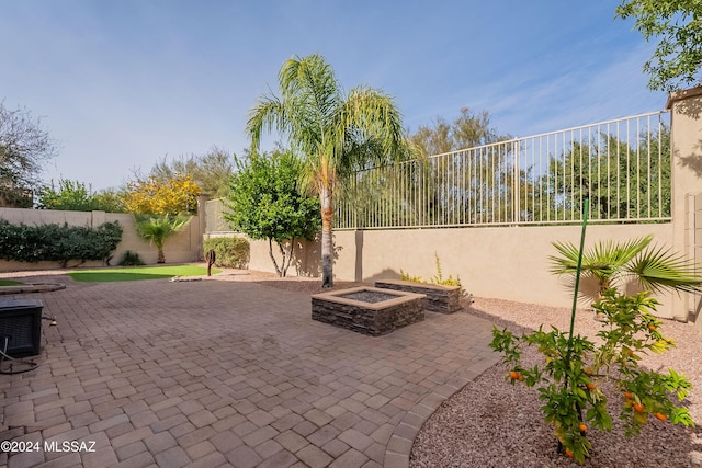 view of patio / terrace featuring a fire pit