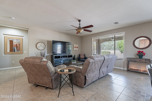 living room featuring ceiling fan and light tile patterned floors