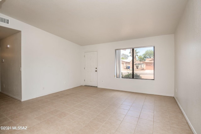 empty room with light tile patterned flooring