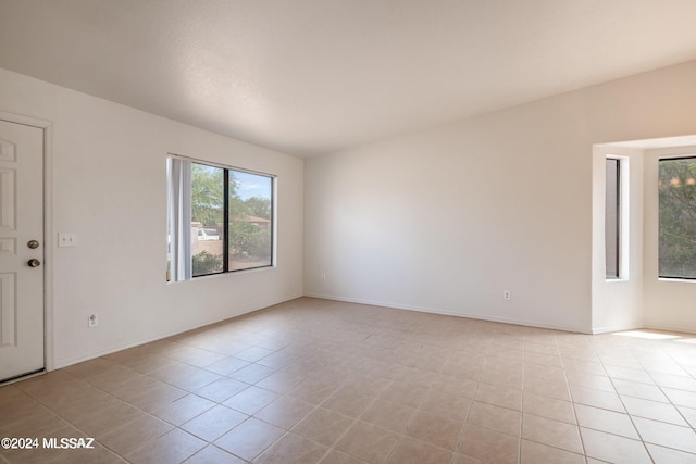 empty room with light tile patterned floors