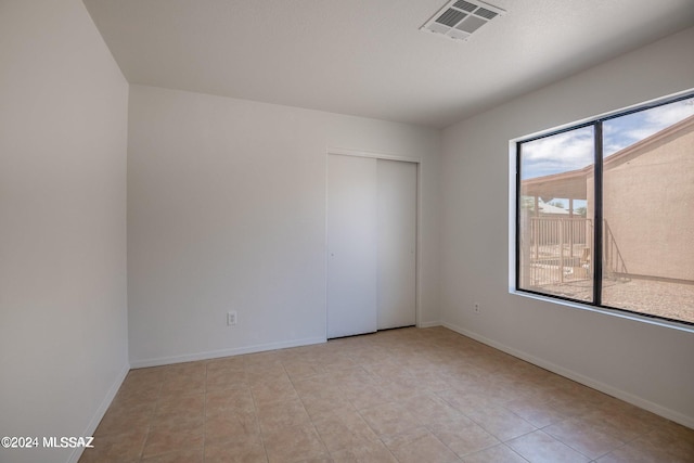 view of tiled spare room