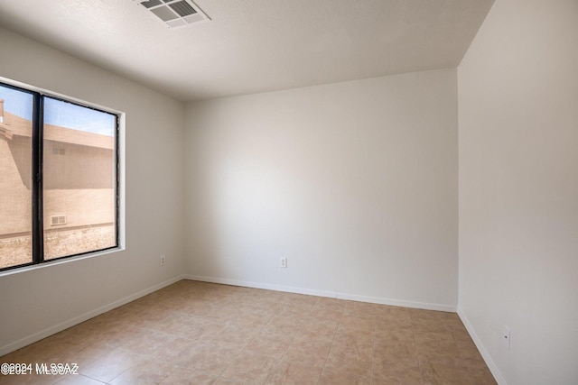 view of tiled spare room