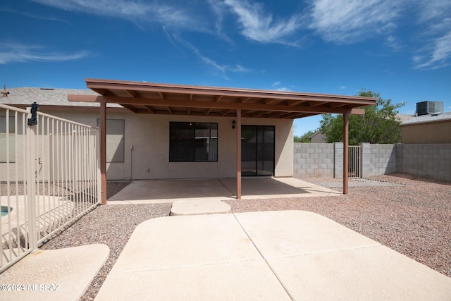 back of property with a patio area and central AC unit