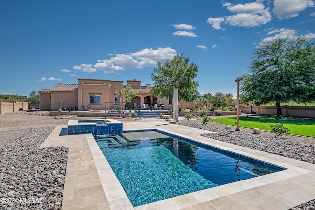 view of swimming pool featuring an in ground hot tub and a patio