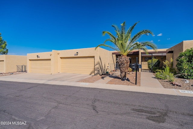 southwest-style home with a garage