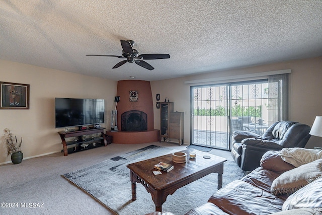 carpeted living room featuring ceiling fan and a textured ceiling