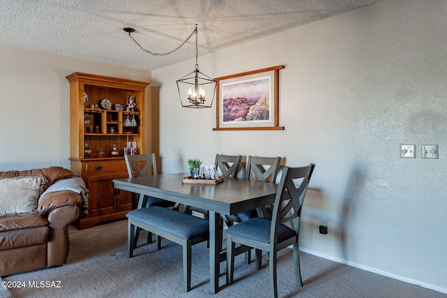 carpeted dining room with a textured ceiling and a chandelier