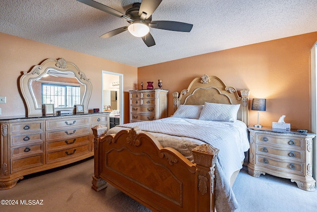 carpeted bedroom with ceiling fan, a textured ceiling, and connected bathroom