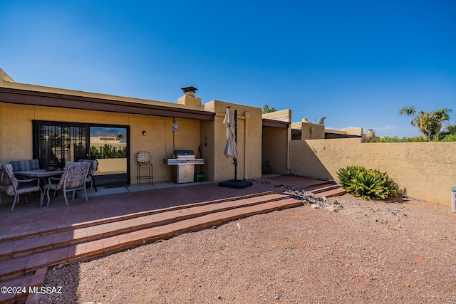 rear view of property with a patio area