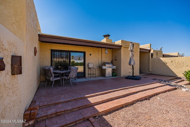 rear view of house with a patio area