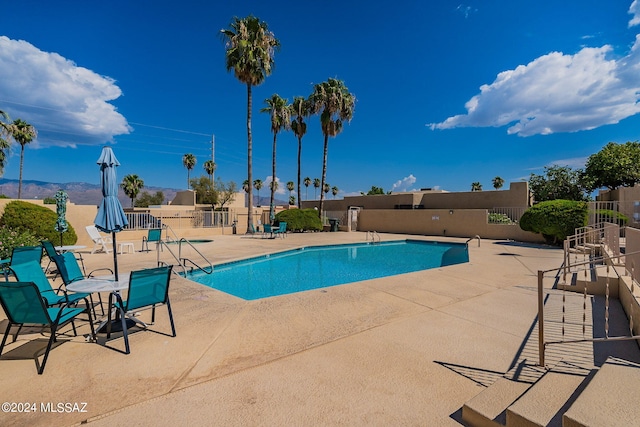 view of swimming pool featuring a patio