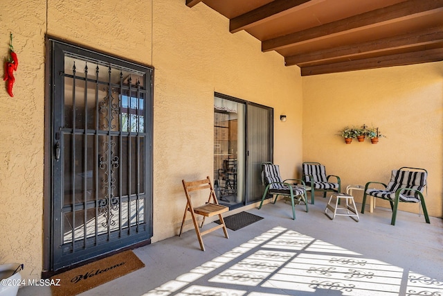 doorway to property with a patio