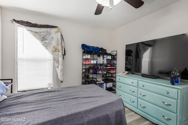 bedroom featuring ceiling fan and light wood-type flooring