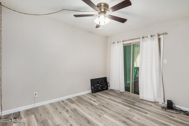 spare room with light hardwood / wood-style floors and ceiling fan