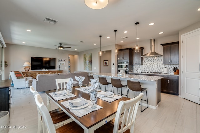 dining area featuring light tile patterned flooring and ceiling fan