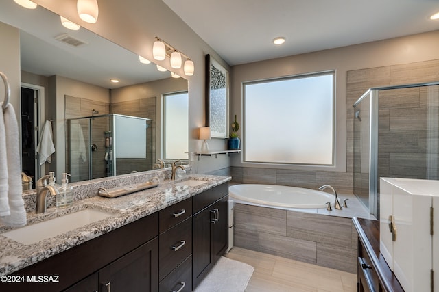 bathroom with vanity, plus walk in shower, and tile patterned floors