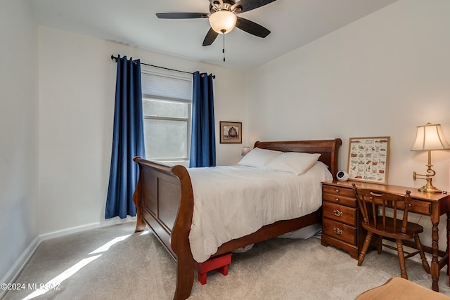 bedroom with light carpet and ceiling fan