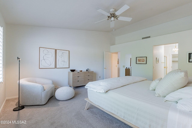 bedroom with carpet floors, ceiling fan, visible vents, baseboards, and lofted ceiling