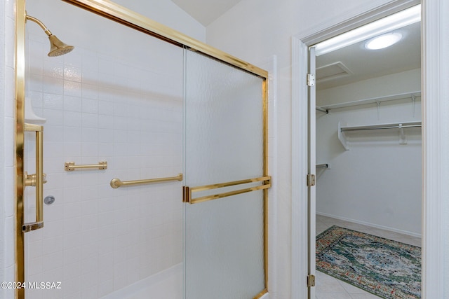 bathroom with a shower with shower door