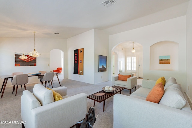 carpeted living room featuring lofted ceiling