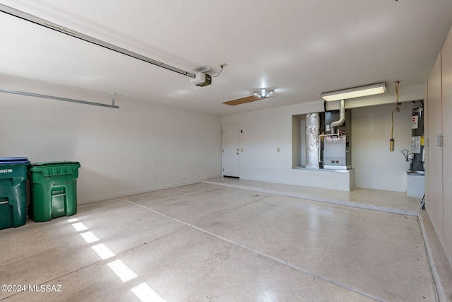 garage with heating unit and water heater