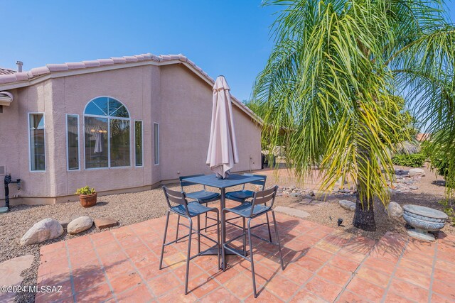 view of patio featuring outdoor dining area
