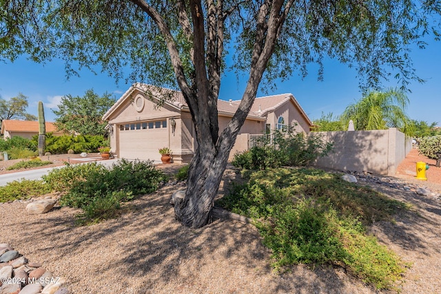 ranch-style house featuring a garage