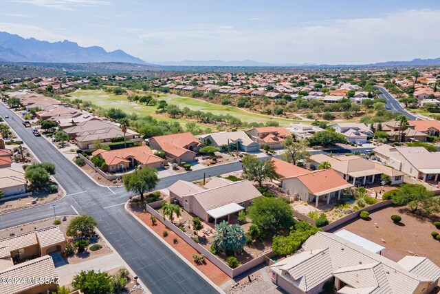 birds eye view of property featuring a mountain view, a residential view, and view of golf course