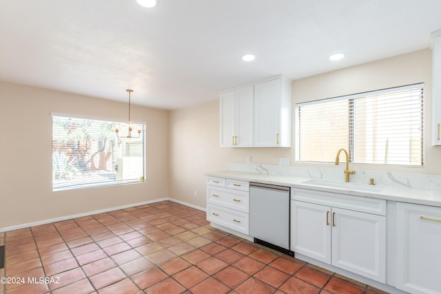 kitchen with dishwasher, decorative light fixtures, sink, and white cabinetry