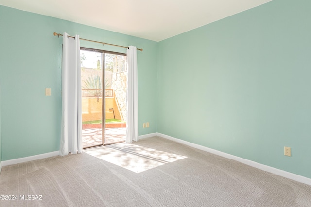 spare room featuring carpet flooring