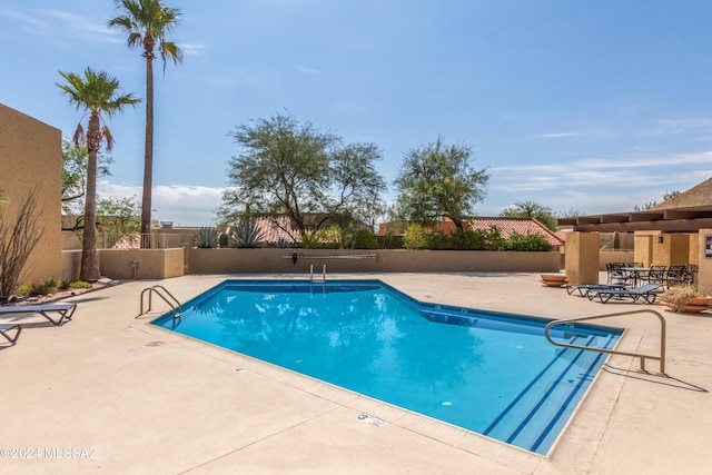 view of swimming pool featuring a patio area