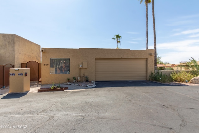 adobe home featuring a garage