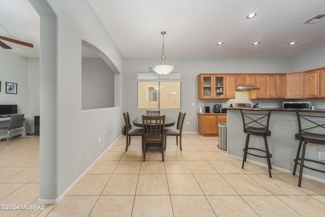 dining room with ceiling fan, visible vents, light tile patterned floors, baseboards, and recessed lighting